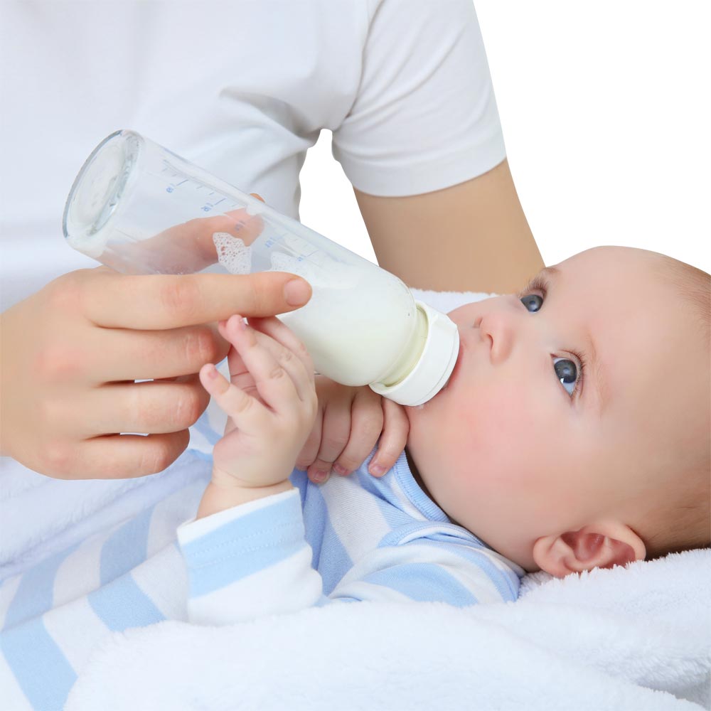 Muttermilch mit dem Fläschchen Muttermilch mit dem Fläschchen